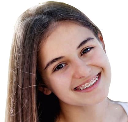 Young woman smiling brightly at camera, showcasing healthy teeth against white background.